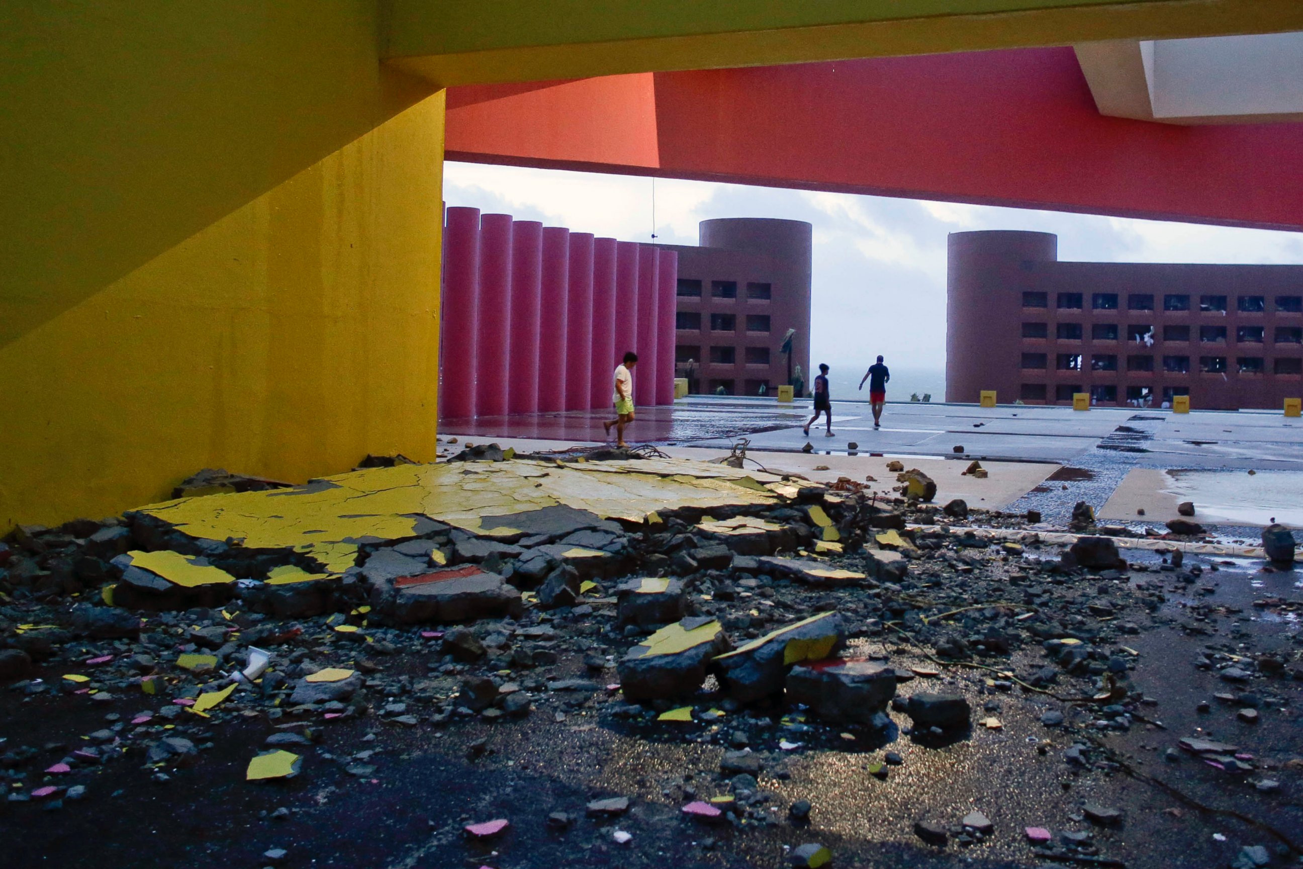 PHOTO: Tourists walks near the entrance of the resort, partially destroyed by Hurricane Odile, in Los Cabos, Mexico, Sept. 15, 2014.