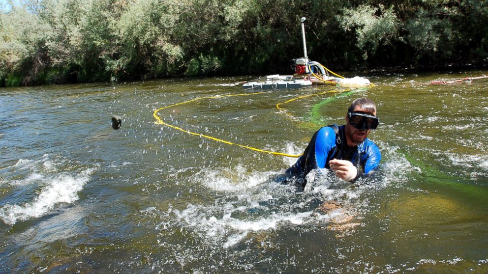 Matt Lauer of Portage, Wisconsin, works a suction dredge to hunt for gold in the Klamath River near Happy Camp, California, Aug. 5, 2009. 
