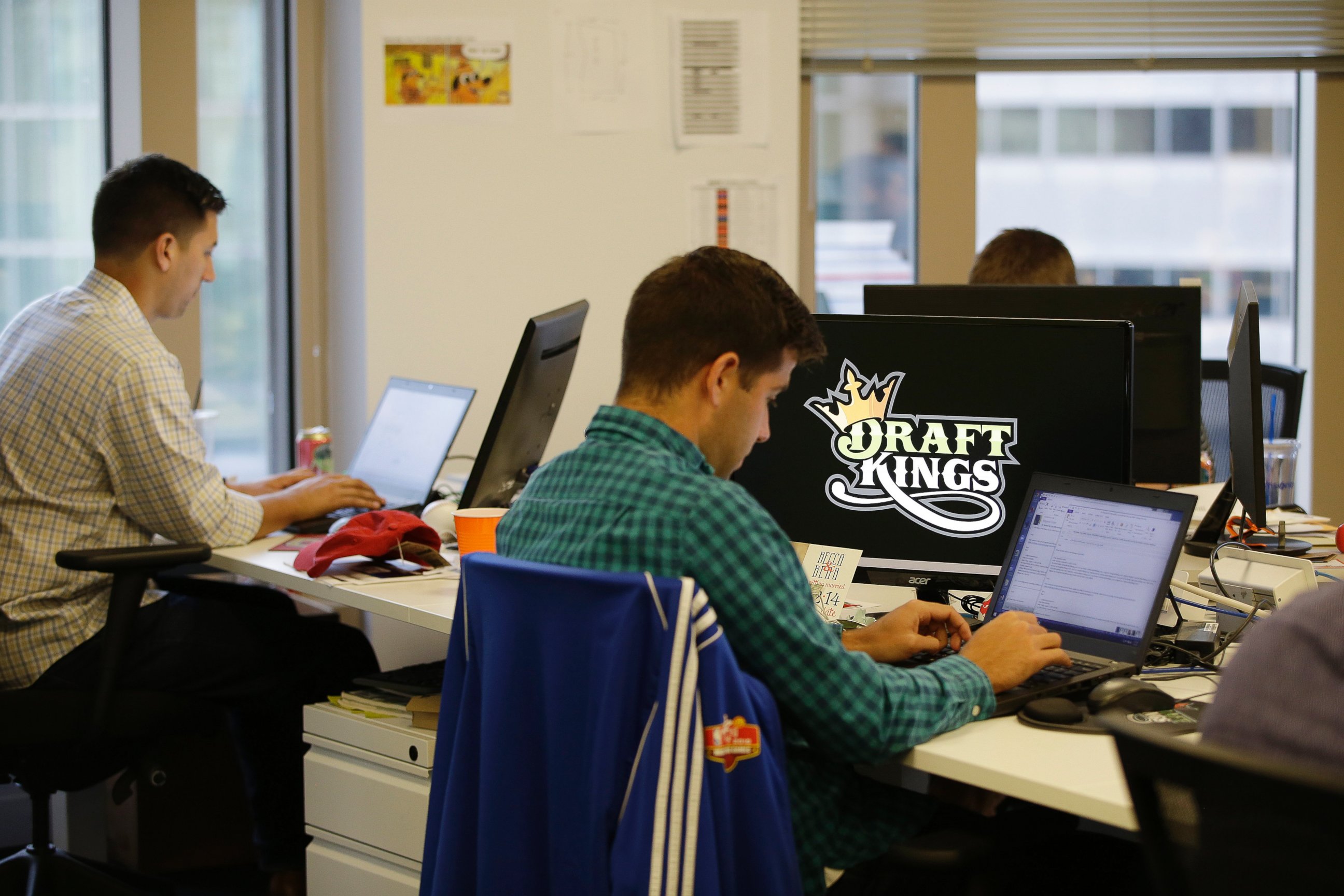 PHOTO:Bear Duker, a marketing manager for strategic partnerships at DraftKings, a daily fantasy sports company, works at his computer in Boston, Sept.9, 2015.  