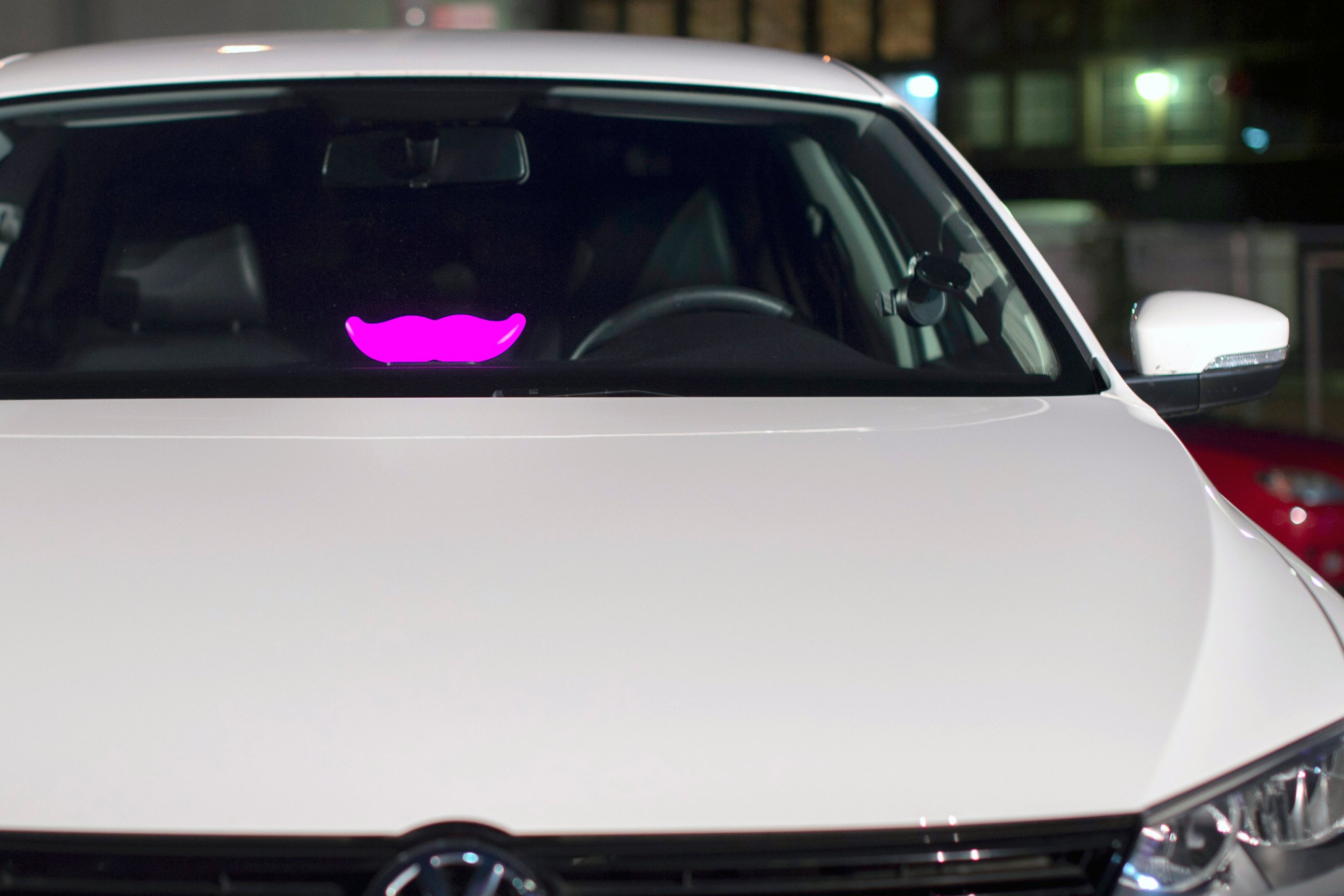 PHOTO: A Lyft "glowstache" rests on a dashboard of a car at the company's San Francisco headquarters on Jan. 26, 2015. 