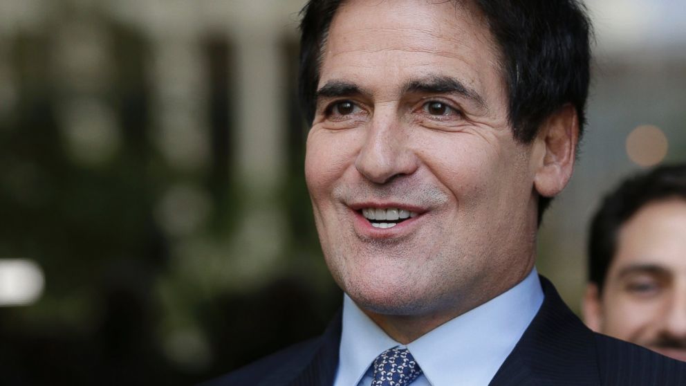 Dallas Mavericks NBA basketball team owner and business man Mark Cuban smiles as he stands outside the federal courthouse after a verdict in his insider trading trial in Dallas, Wednesday, Oct. 16, 2013. 