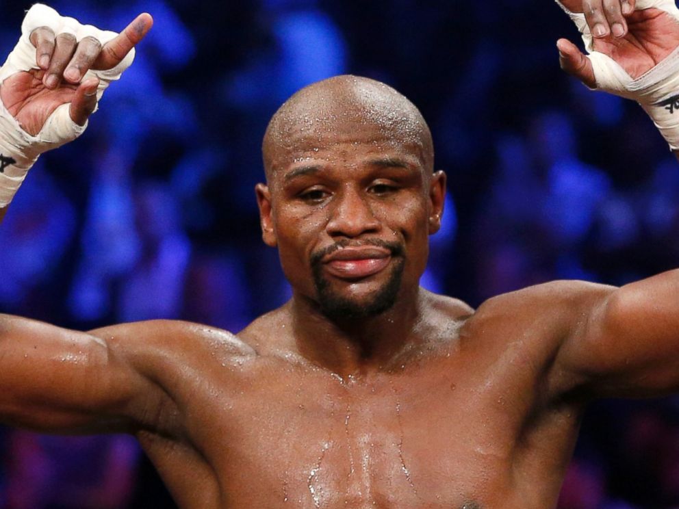 PHOTO: Floyd Mayweather Jr., celebrates his unanimous decision victory over Manny Pacquiao, from the Philippines, at the finish of their welterweight title fight, May 2, 2015, in Las Vegas.
