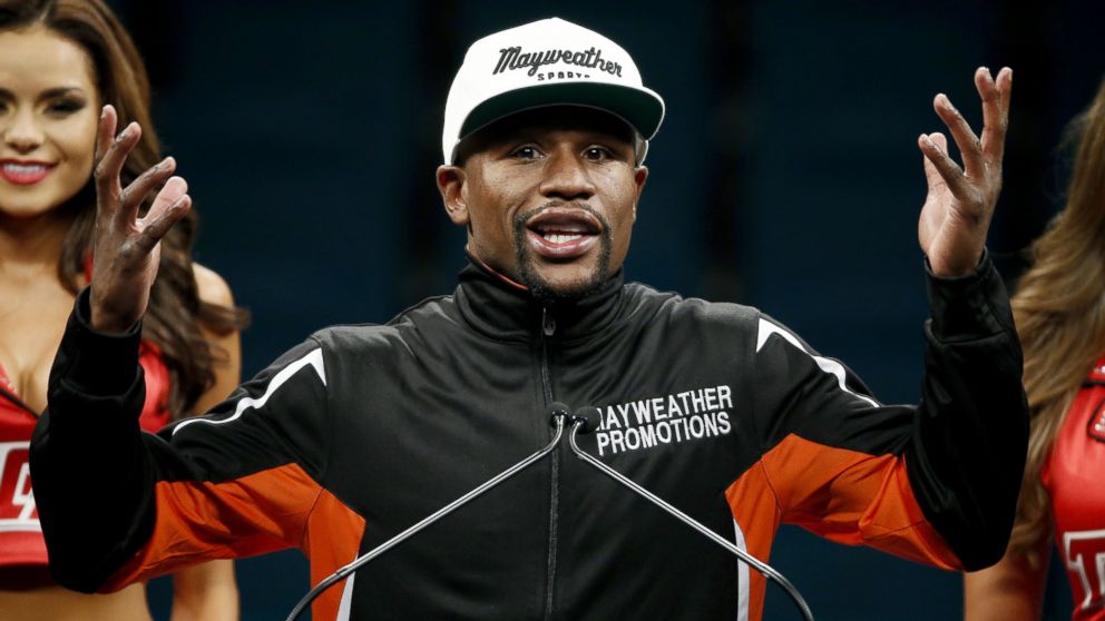 Floyd Mayweather Jr. in Louis Vuitton Logo Sweater at Fight Press  Conference