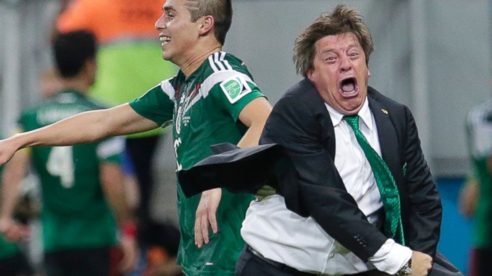 Mexico's head coach Miguel Herrera celebrates after Mexico's Andres Guardado  scored his side's second goal during the group A World Cup soccer match between Croatia and Mexico at the Arena Pernambuco in Recife, Brazil, June 23, 2014.  