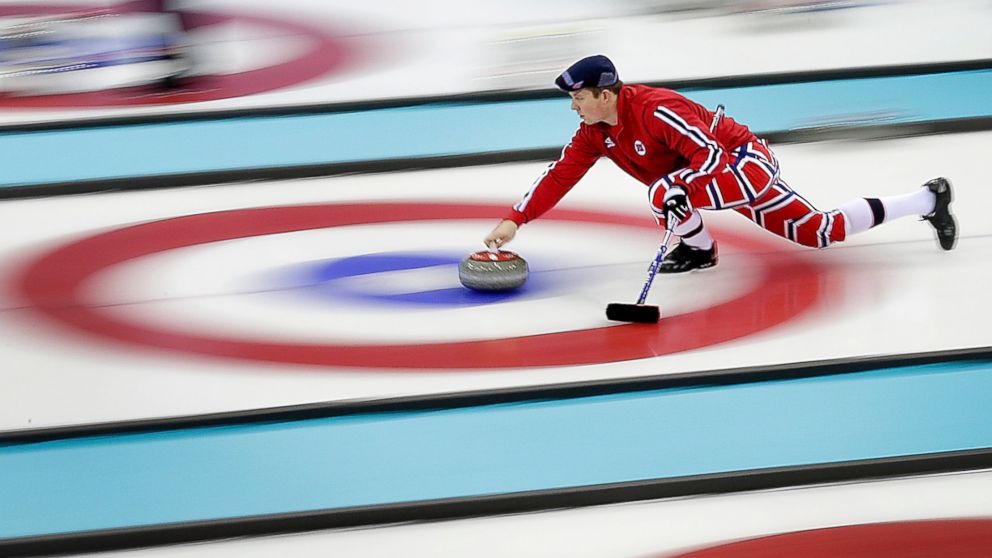 PHOTO: Norway's Christoffer Svae delivers the stone during the men's curling training session at the 2014 Winter Olympics, Feb. 9, 2014, in Sochi, Russia.