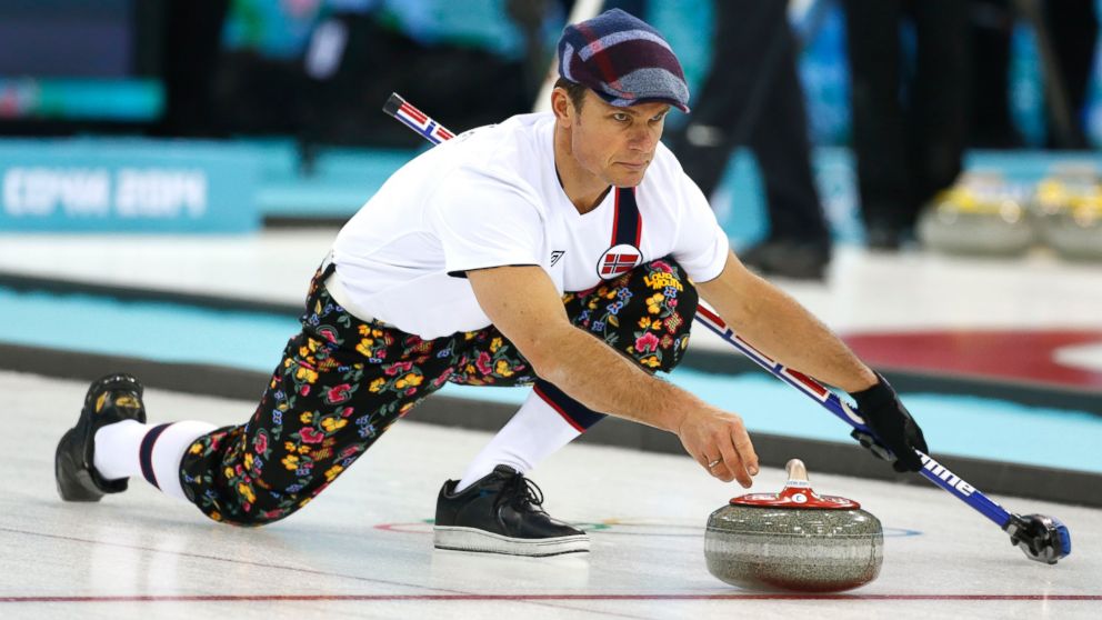 PHOTO: Norway skip Thomas Ulsrud, wearing rose-painting knickers and a patterned flat cap, delivers the stone during curling training at the 2014 Winter Olympics, Feb. 8, 2014, in Sochi, Russia.