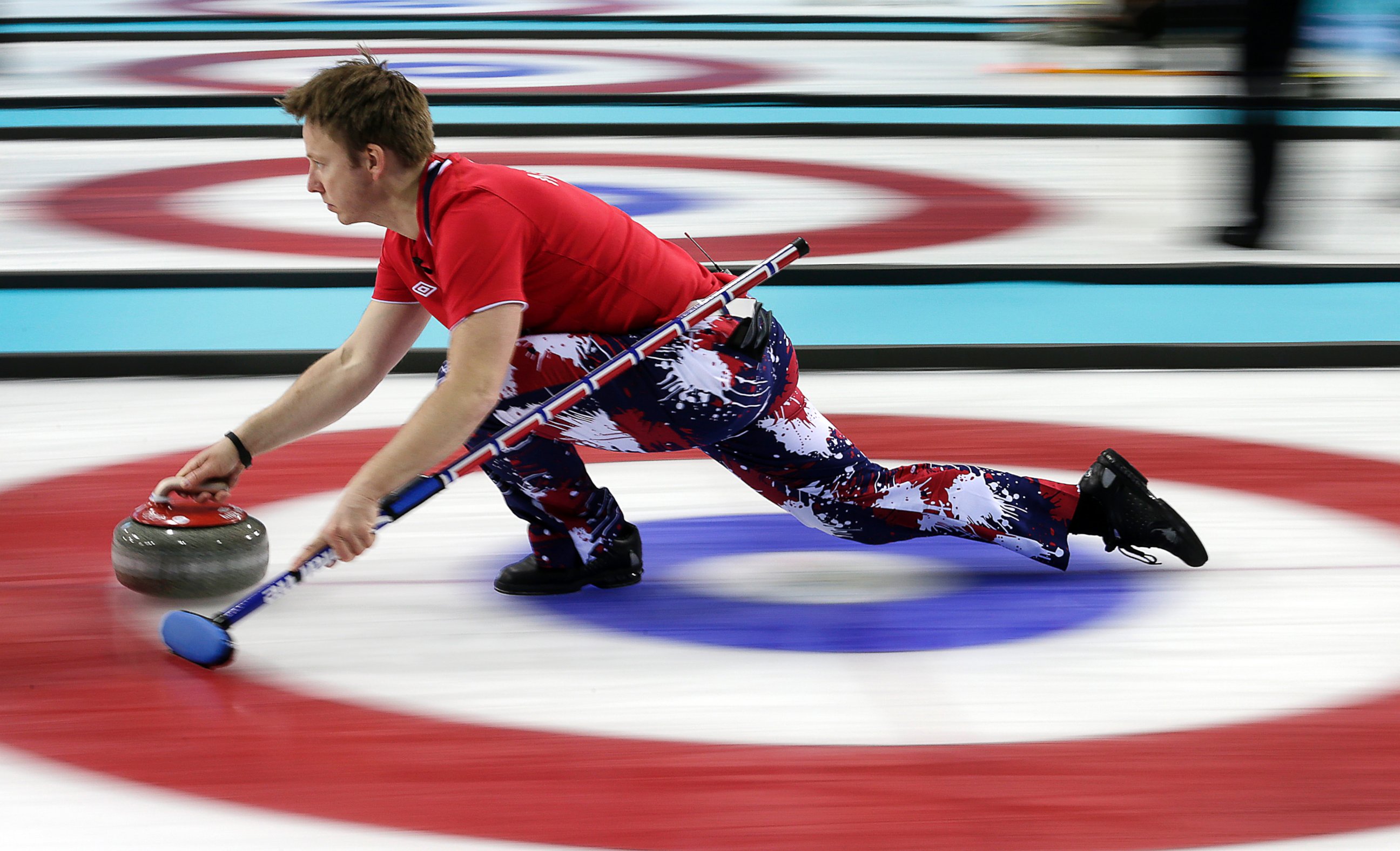 PHOTO: Norway's Torger Nergaard delivers the rock during the men's curling competition against Russia at the 2014 Winter Olympics, Feb. 11, 2014, in Sochi, Russia.