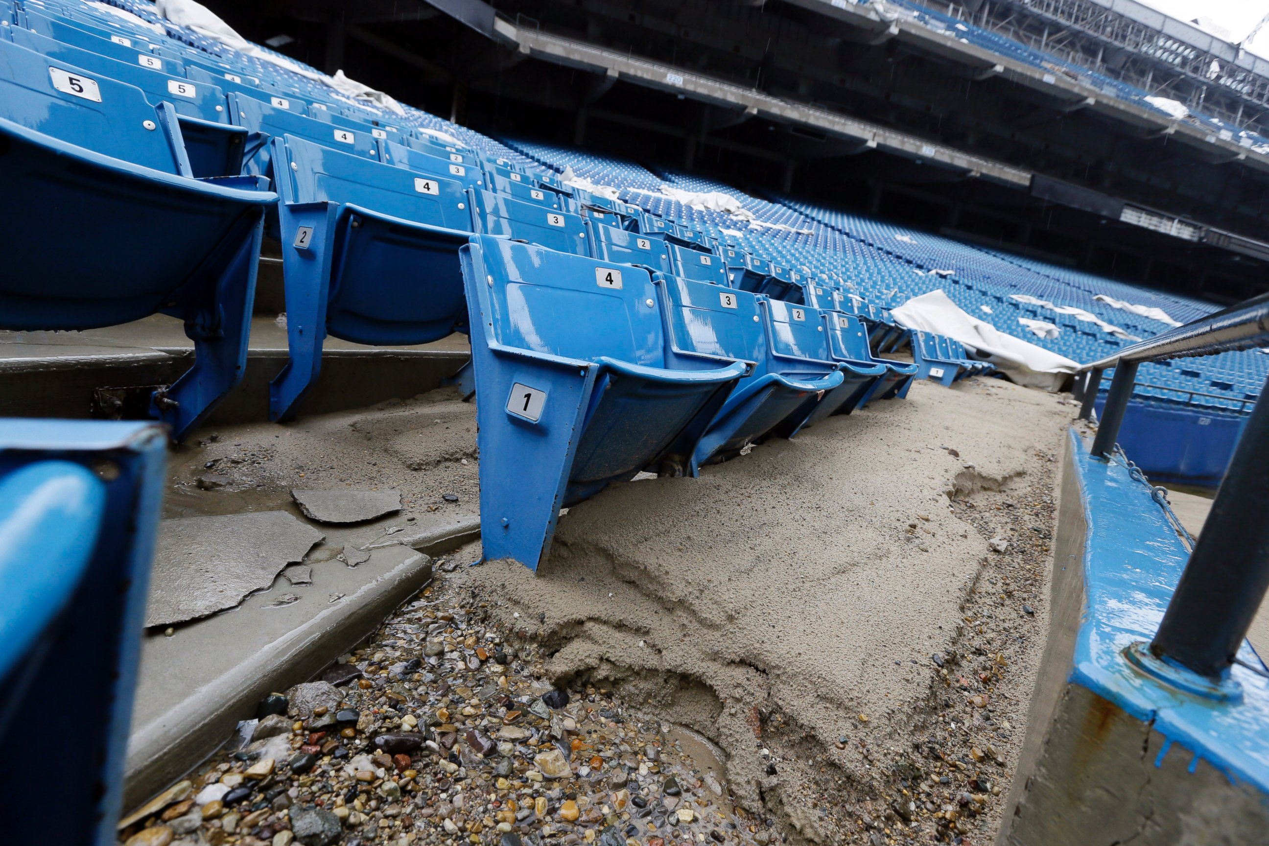PHOTO: Foundation sand from cracked cement covers seats inside the Pontiac Silverdome in Pontiac, Mich. in this May 12, 2014 photo.