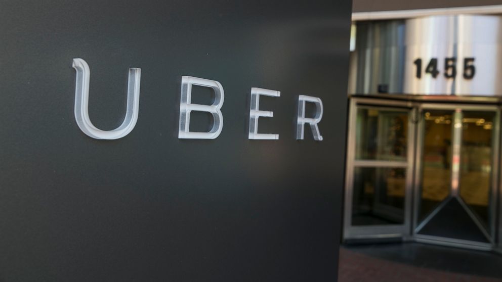 A logo sign outside of the headquarters of the ride sharing app, Uber, is seen in this file photo, Dec. 29, 2014,in downtown San Francisco.