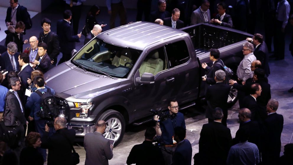 Journalists surround the new F-150 with a body built almost entirely out of aluminum at the North American International Auto Show in Detroit, Jan. 13, 2014. 