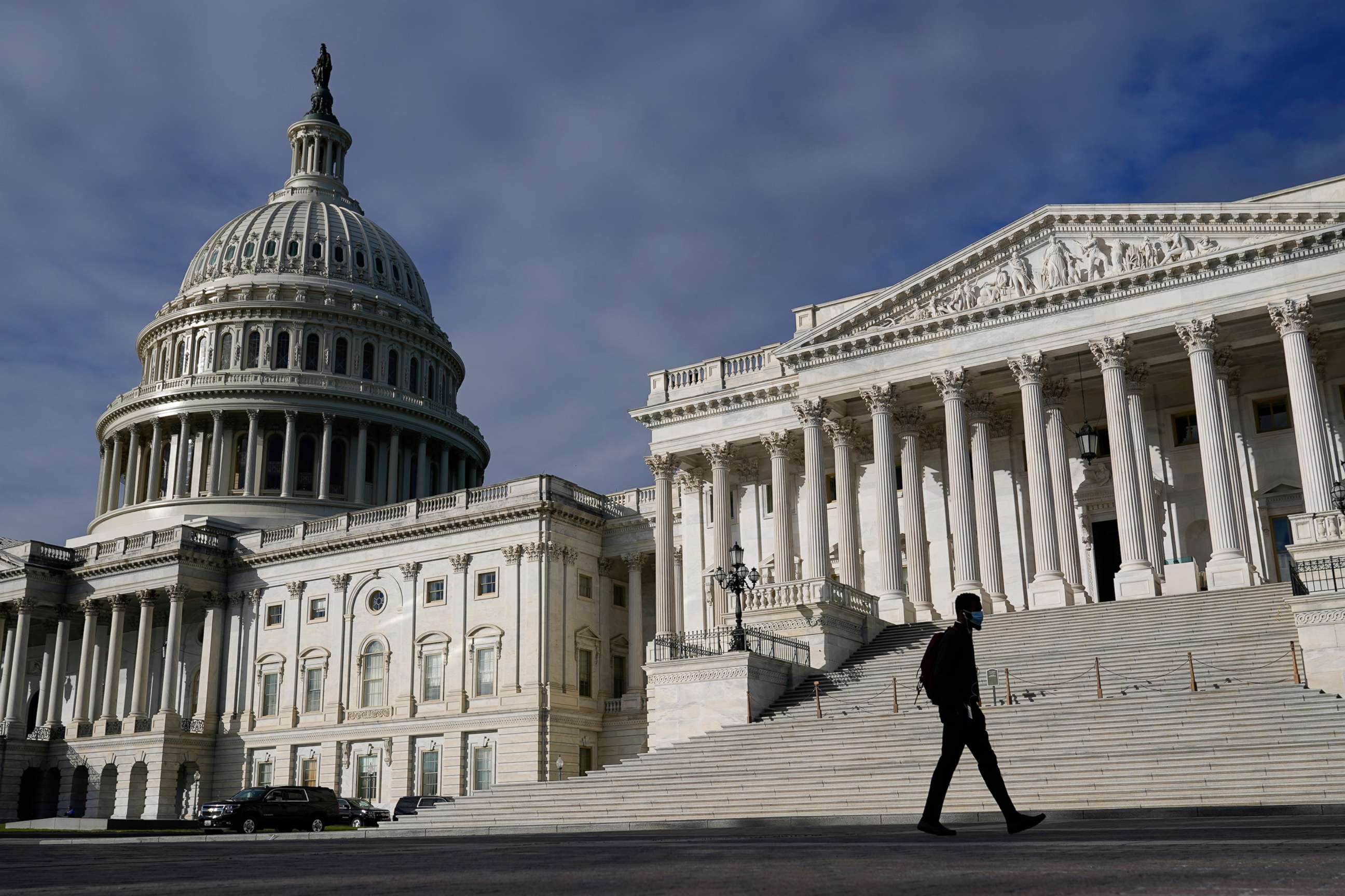 PHOTO: A man walks past the the Capitol, Oct. 27, 2021, on Capitol Hill.