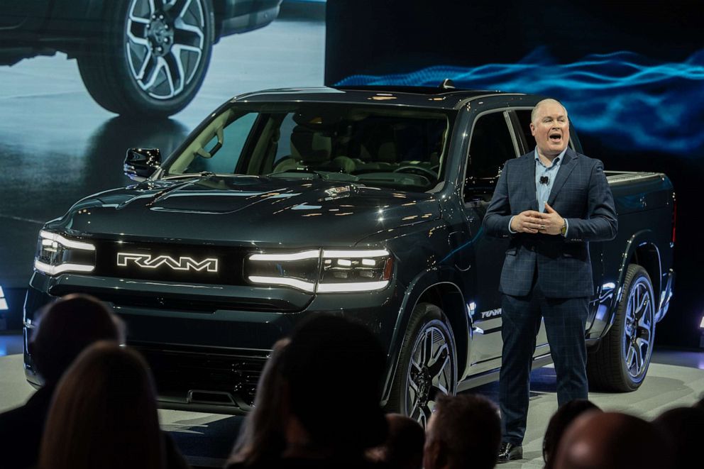 PHOTO: Mike Koval, chief executive officer of Ram Brand, speaks next to a 2024 RAM 1500 REV electric pickup during the 2023 New York International Auto Show (NYIAS), April 5, 2023, in New York.