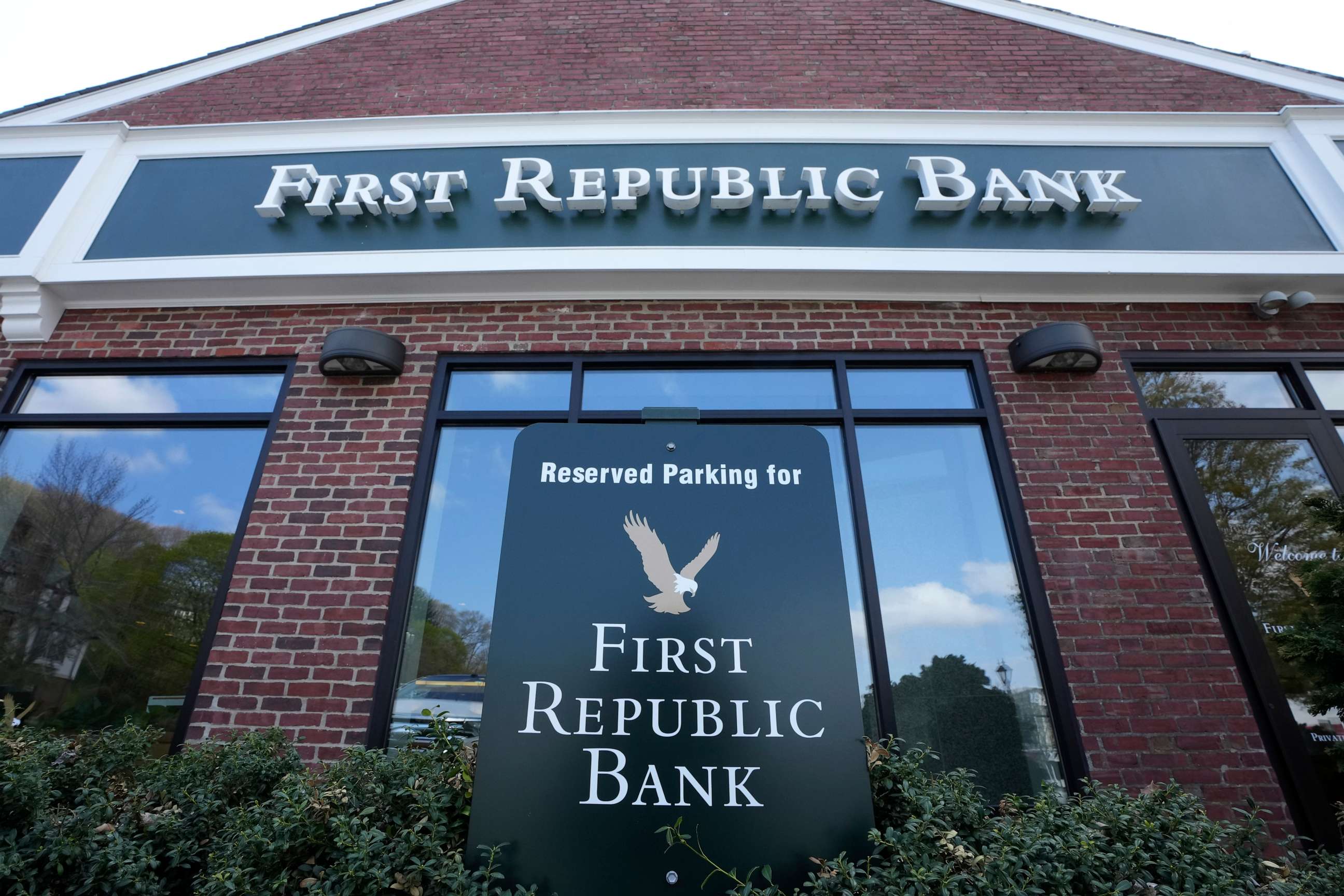 PHOTO: FILE - First Republic Bank signs and logos are displayed on a branch on April 26, 2023, in Wellesley, Mass. Regulators continued their search for a solution to First Republic Bankâs woes before stock markets were set to open Monday, May 1.