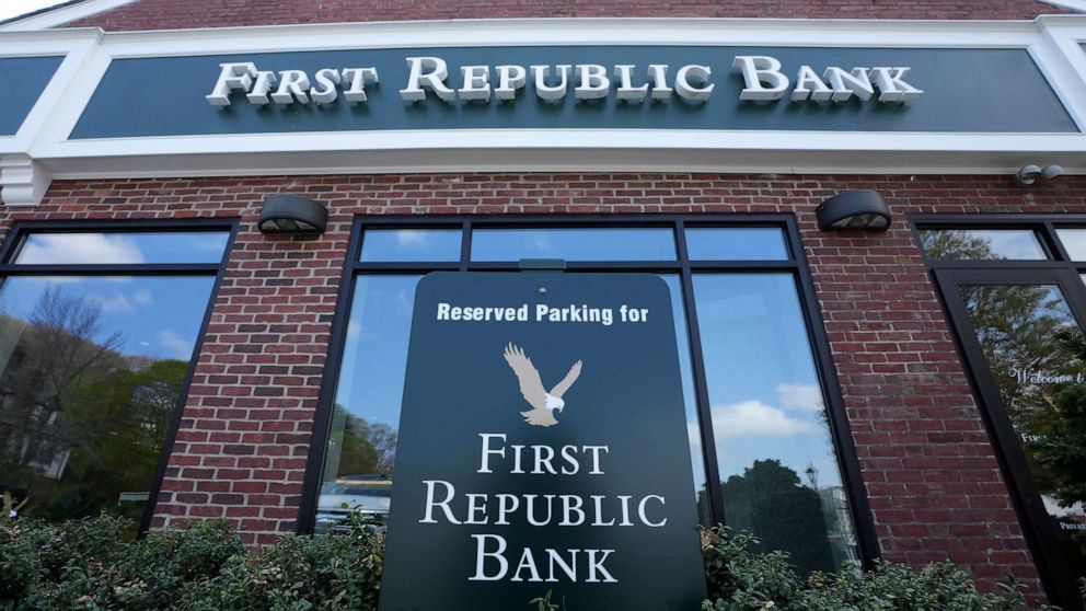 PHOTO: FILE - First Republic Bank signs and logos are displayed on a branch on April 26, 2023, in Wellesley, Mass. Regulators continued their search for a solution to First Republic Bankâs woes before stock markets were set to open Monday, May 1.