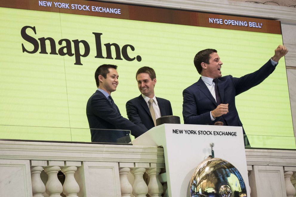 PHOTO: From left, Snapchat co-founders Bobby Murphy, chief technology officer of Snap Inc., and Evan Spiegel, chief executive officer of Snap Inc., ring the opening bell as Thomas Farley, president of the NYSE, looks on, March 2, 2017, in New York. 