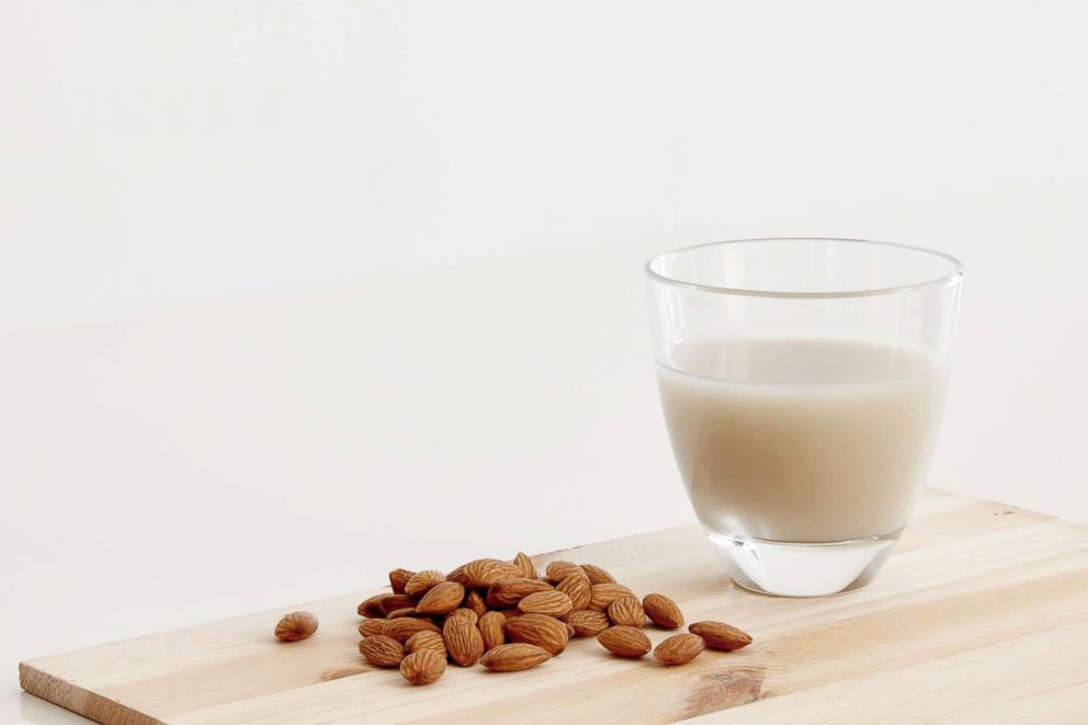 PHOTO: A glass of almond milk stands amid almond seeds in this undated stock photo.