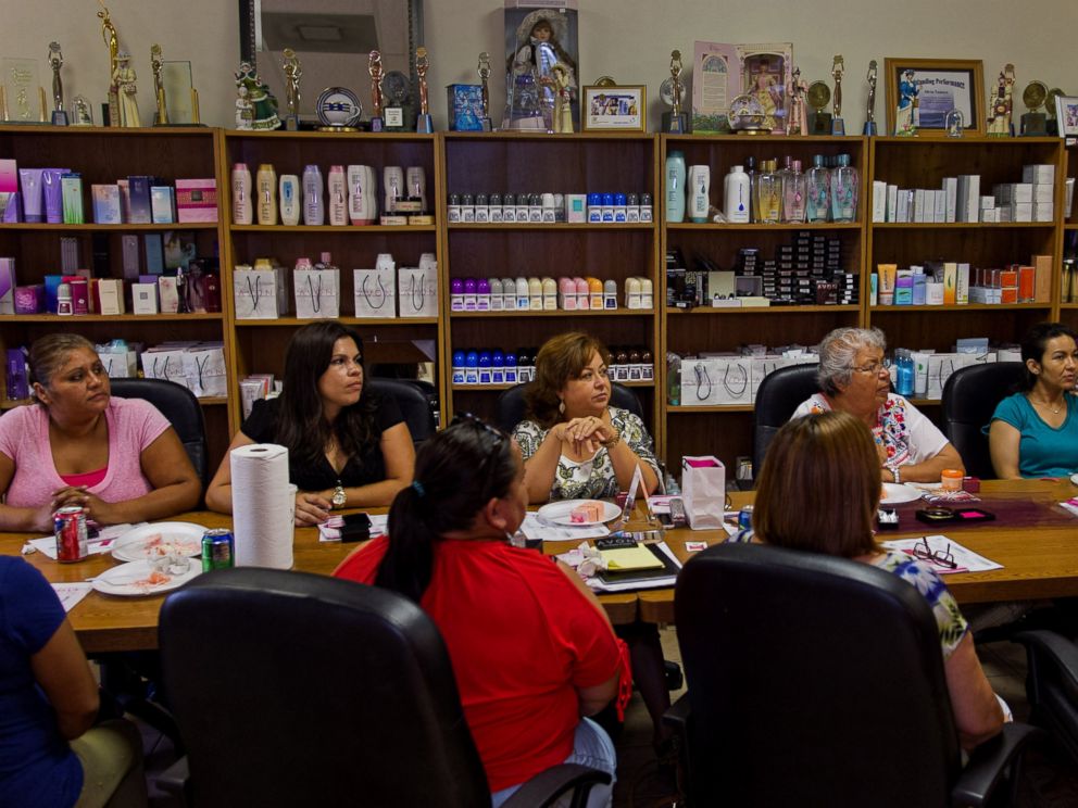 PHOTO: Isabel Hernandez, unit leader and independent sales representative for Avon Products Inc., center, attends a weekly sales meeting on Aug. 28, 2014 in McAllen, Texas.