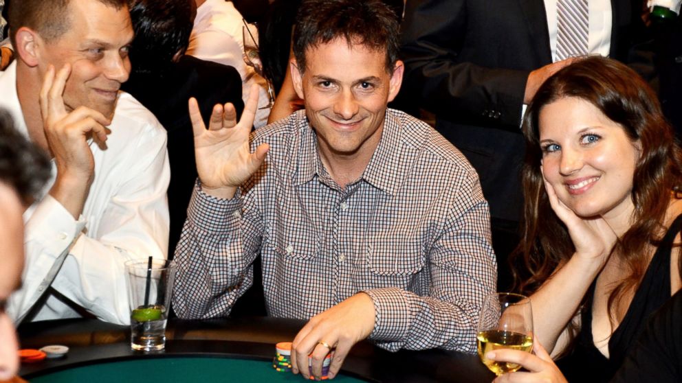 PHOTO: PHOTO: David Einhorn, center, president of Greenlight Capital Inc., attended the fourth annual Take 'Em To School Poker Tournament in New York, U.S., in this July 23, 2013, file photo. 