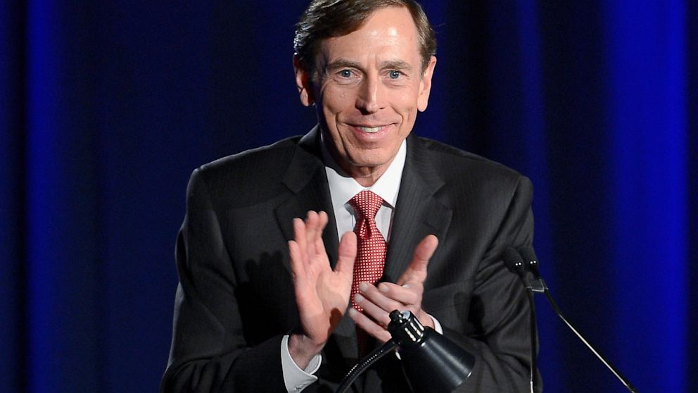 Former CIA director and retired four-star general General David Petraeus applauds as he makes his first public speech since resigning at University of Southern California dinner for students Veterans and ROTC, March 26, 2013, in Los Angeles.