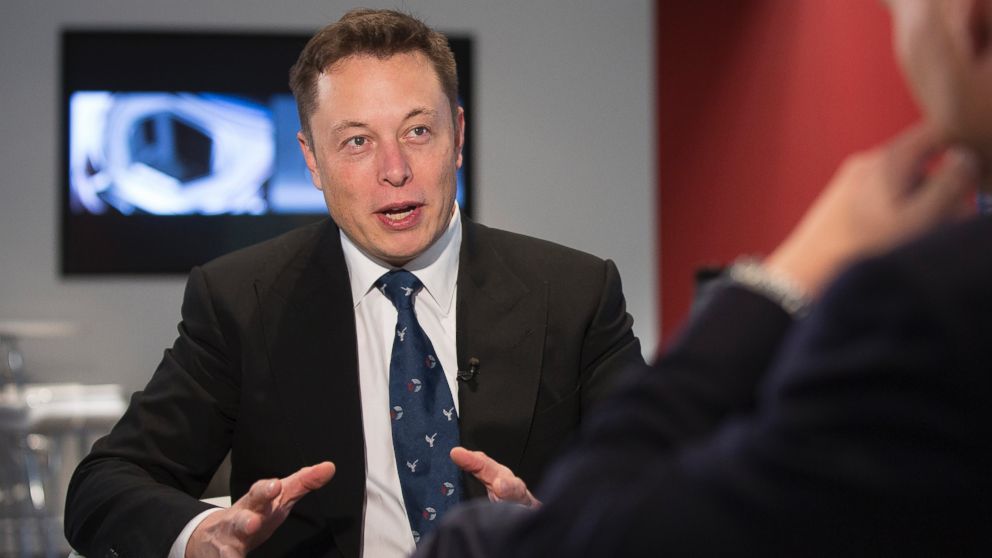 PHOTO: Elon Musk, billionaire, co-founder and chief executive officer of Tesla Motors Inc., gestures during an interview inside the Tesla store at Westfield Stratford City retail complex in London, Oct. 24, 2013.  