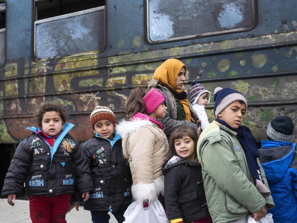 PHOTO: Migrants and refugees board a train heading to Serbia from the Macedonian-Greek border near Gevgelija, Feb. 14, 2016.