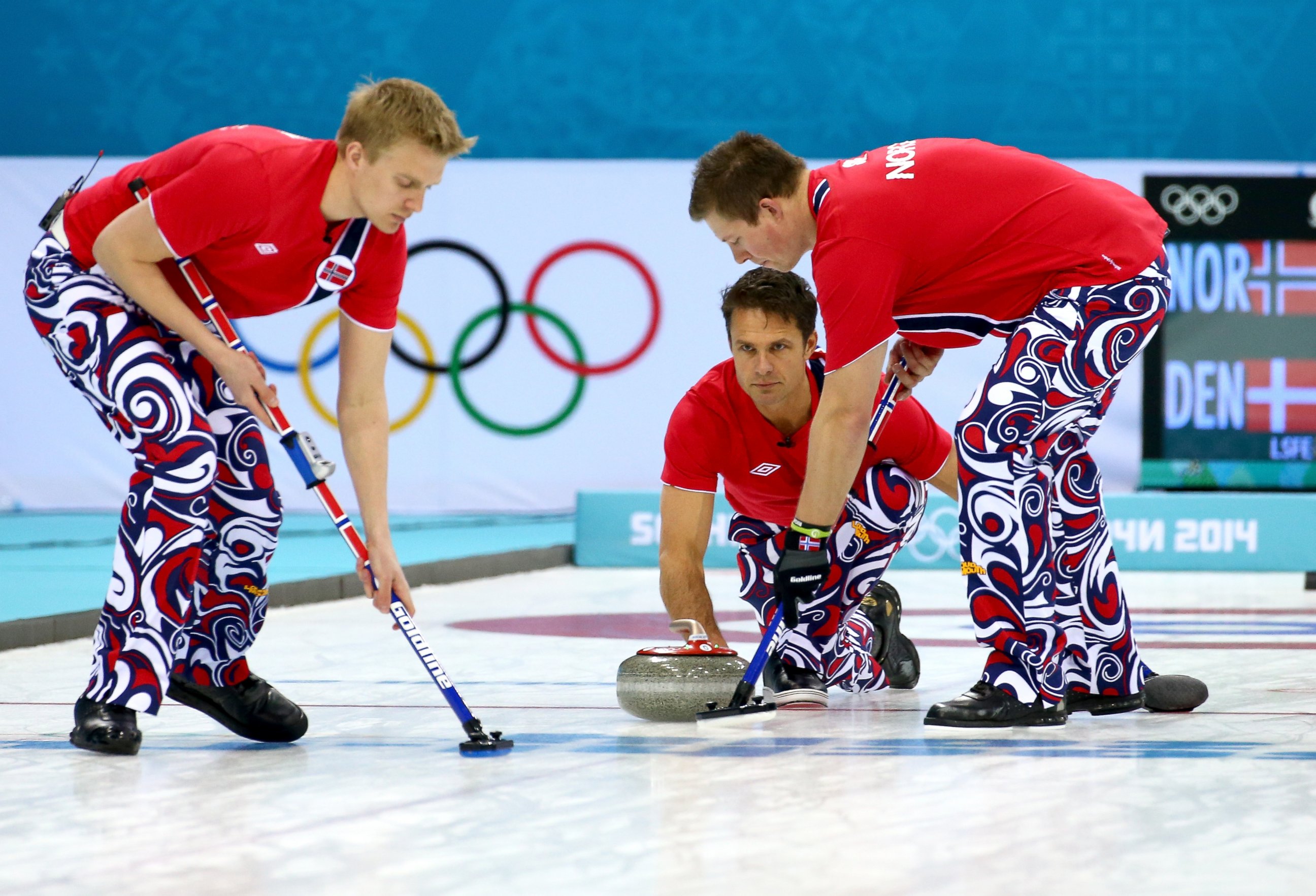 PHOTO: Jaavard Vad Petersson, Thomas Ulsrud and Christoffer Svae of Norway compete against Denmark during the Men's Curling Round Robin on Feb. 17, 2014.  