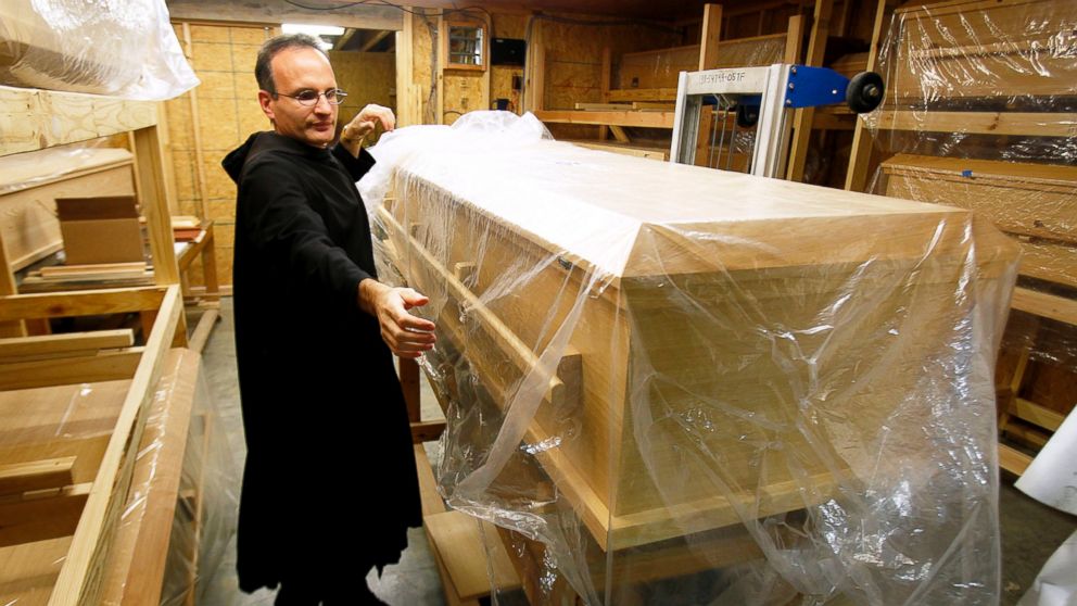 Brother Emmanuel Labrise of St. Joseph's Abbey prepares a casket for lining in 2012 in Covington, Louisiana.