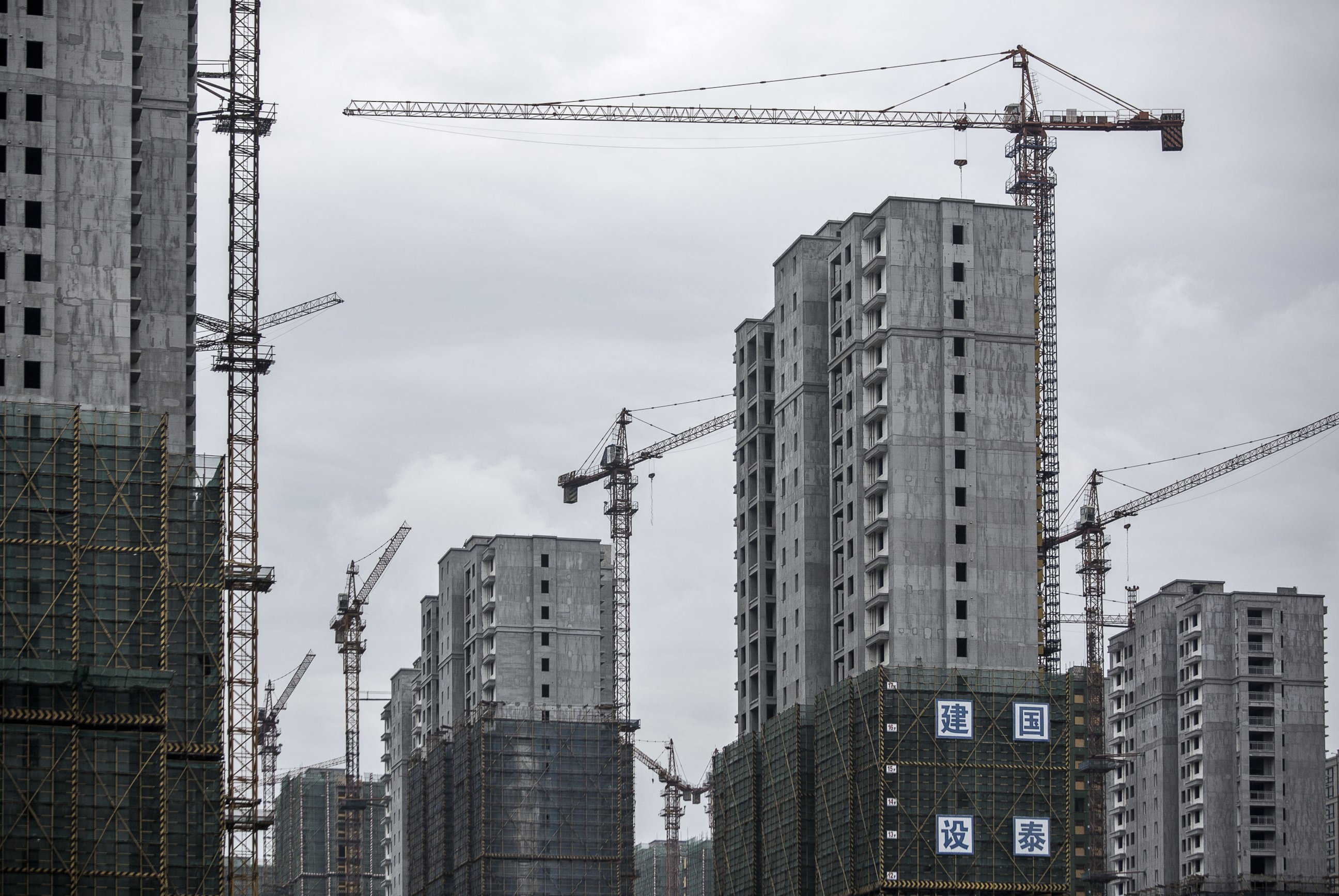 PHOTO: Cranes stand idle at buildings under construction in Hangzhou, China, Sept. 5, 2016.  