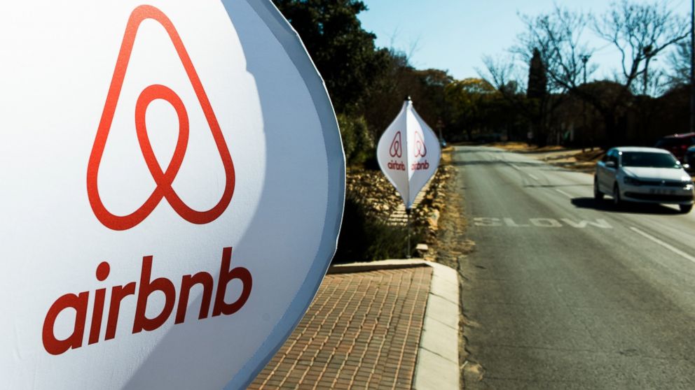 The logos of Airbnb Inc. sit on banners displayed outside a media event in Johannesburg, South Africa, July 27, 2015.