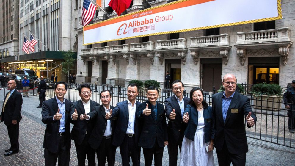 Executive Chairman of Alibaba Group Jack Ma (C) and other executives pose for a photo outside the New York Stock Exchange prior to the company's initial price offering (IPO), Sept. 19, 2014, in New York.