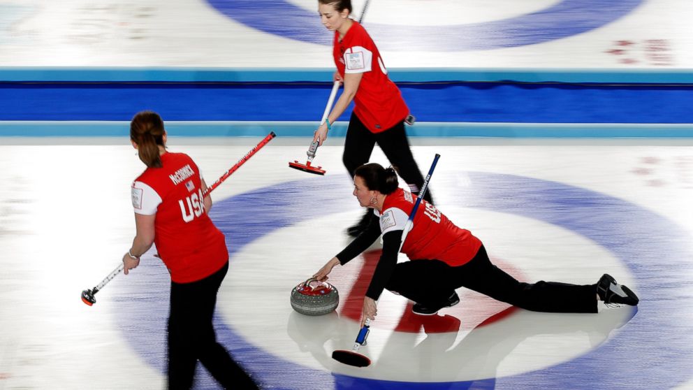 PHOTO: Ann Swisshelm of the United States throws a stone during a match between Canada and USA