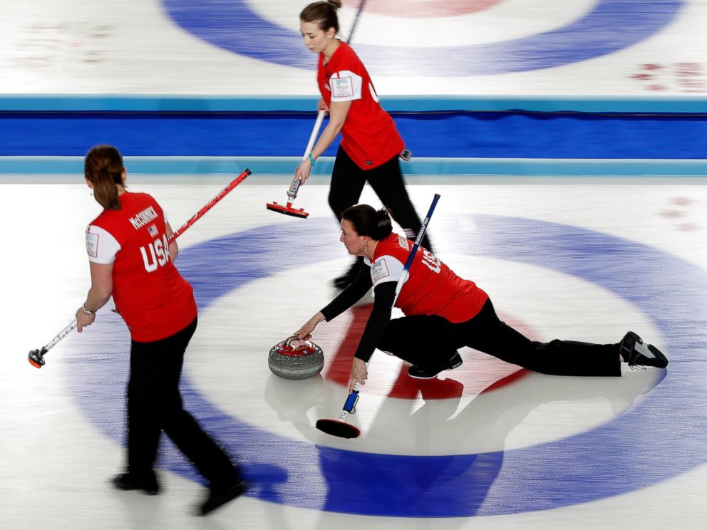 PHOTO: Ann Swisshelm of the United States throws a stone during a match between Canada and USA