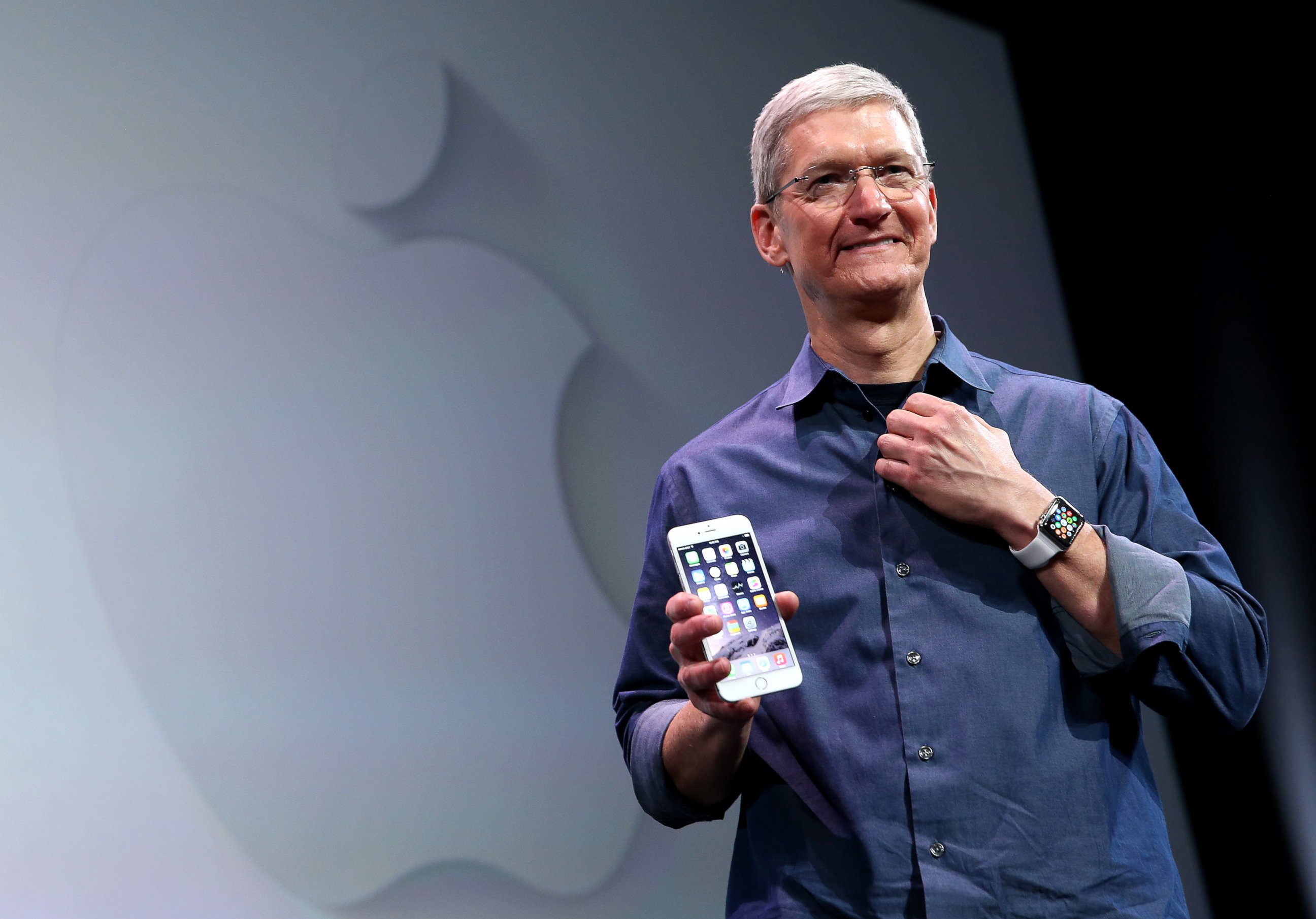 PHOTO: Apple CEO Tim Cook shows off the new iPhone 6 and the Apple Watch during an Apple special event at the Flint Center for the Performing Arts, Sept. 9, 2014, in Cupertino, Calif. 