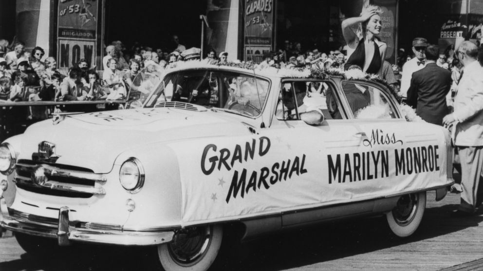 Marilyn Monroe plays grand marshal as she rides on the back of a convertible down the boardwalk during the Miss America Beauty Pageant parade, Sept. 1, 1952, in Atlantic City, N.J.
