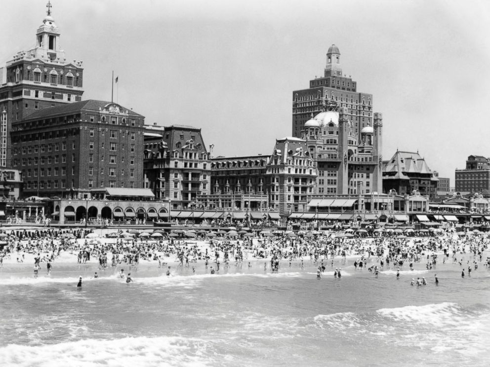 PHOTO: A crowded beach is seen with the boardwalk and hotels of Atlantic City, N.J. in the background, circa 1940s.