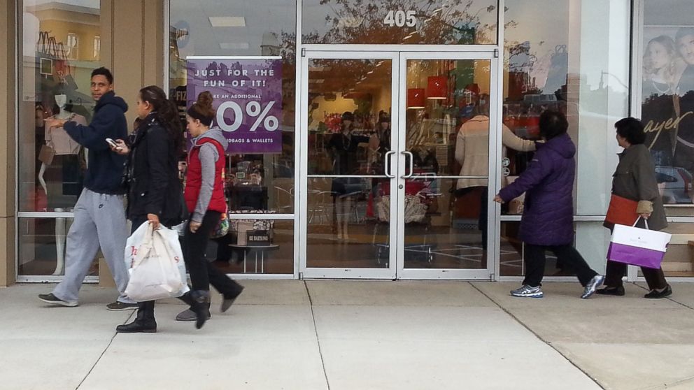 Shoppers walk through the Queenstown Outlets in Queenstown, Maryland, looking for deals ahead of Black Friday sales, Nov. 16, 2014.