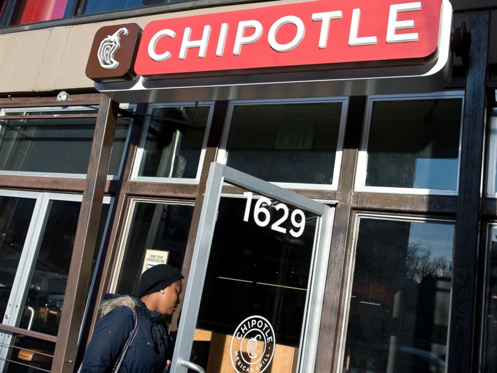 PHOTO: In this file photo, a woman is pictured walking into a Chipotle restaurant in Washington, D.C. on Jan. 31, 2014.