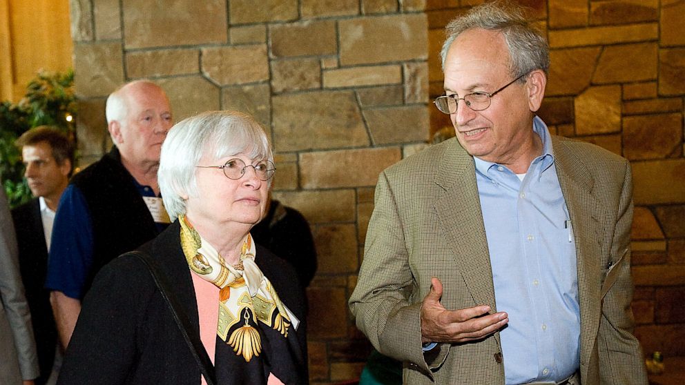 Janet Yellen, left, talks with Donald L. Kohn, as they leave the morning session at the economic symposium, at the Jackson Lake Lodge in Moran, Wyo., Aug. 31, 2012. 