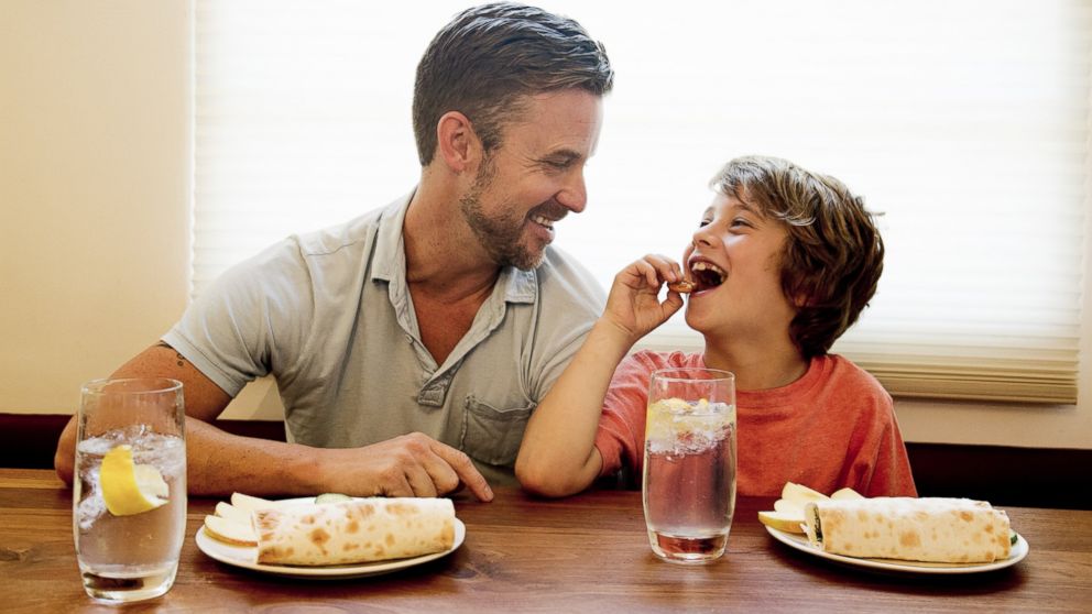 A father is pictured with his son in this stock image. 