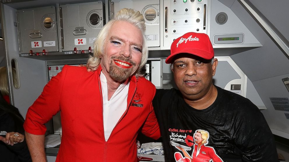 PHOTO: Sir Richard Branson and AirAsia CEO Tony Fernandes on board a flight to Kuala Lumpur at Perth International Airport on May 12, 2013, in Perth, Australia. 