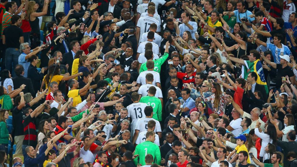 PHOTO: Germany's team walks through fans to be presented with the World Cup trophy after defeating Argentina 1-0 in extra time during the 2014 FIFA World Cup Brazil Final match at Maracana on July 13, 2014 in Rio de Janeiro, Brazil.