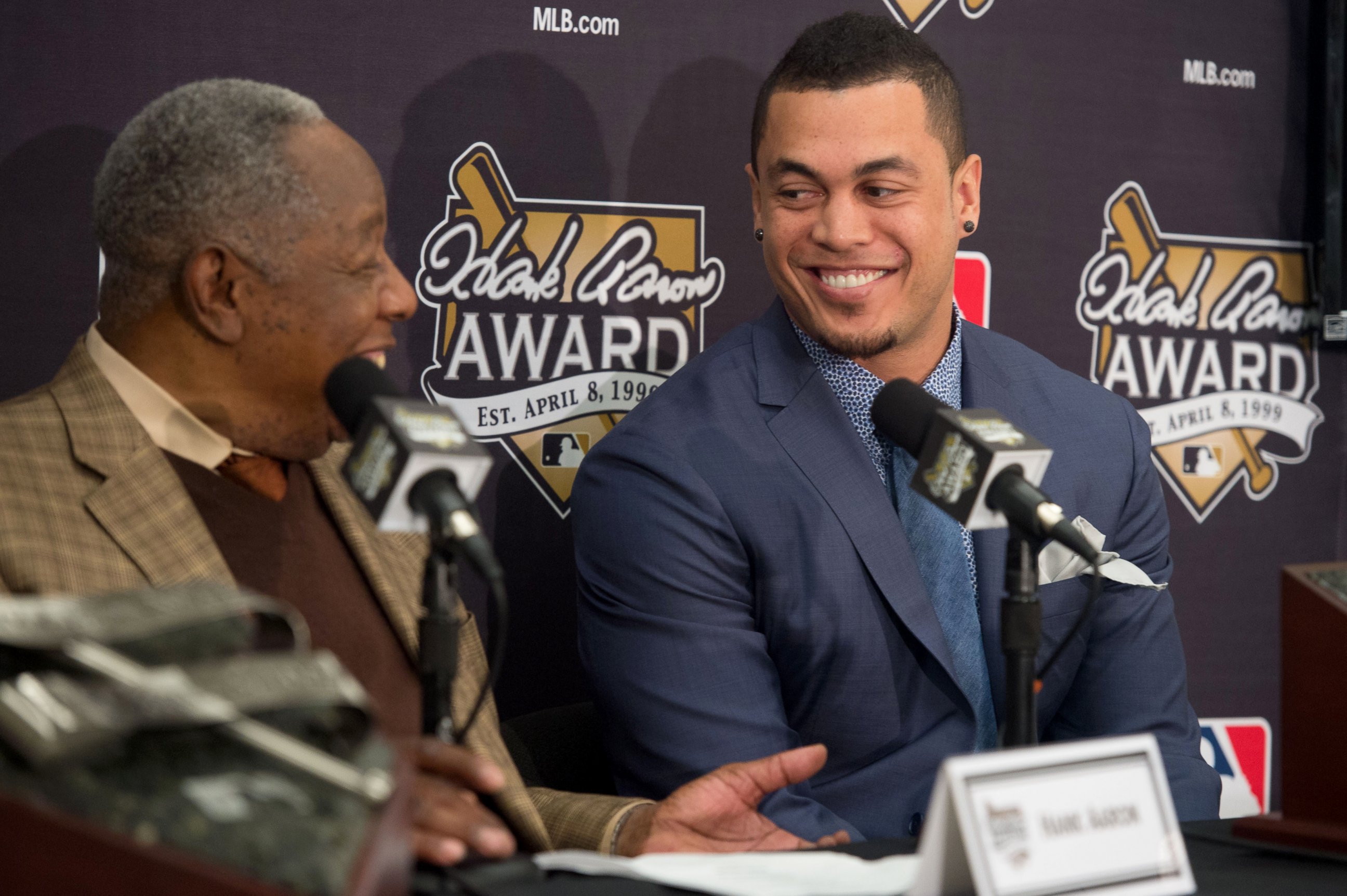PHOTO: Hall of Famer Hank Aaron, left, and 2014 Hank Aaron Award recipient Giancarlo Stanton #27 of the Florida Marlins share a laugh during the Hank Aaron Award press conference, Oct. 25, 2014, in San Francisco.