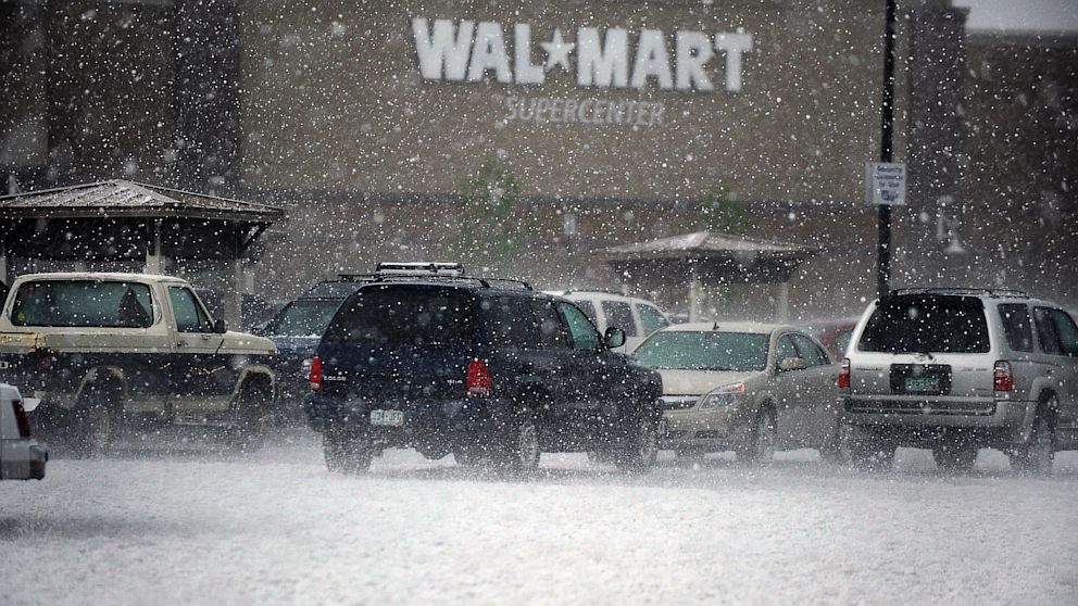 PHOTO: Hail pounds cars in the Wal Mart parking lot in Westminster during a storm.