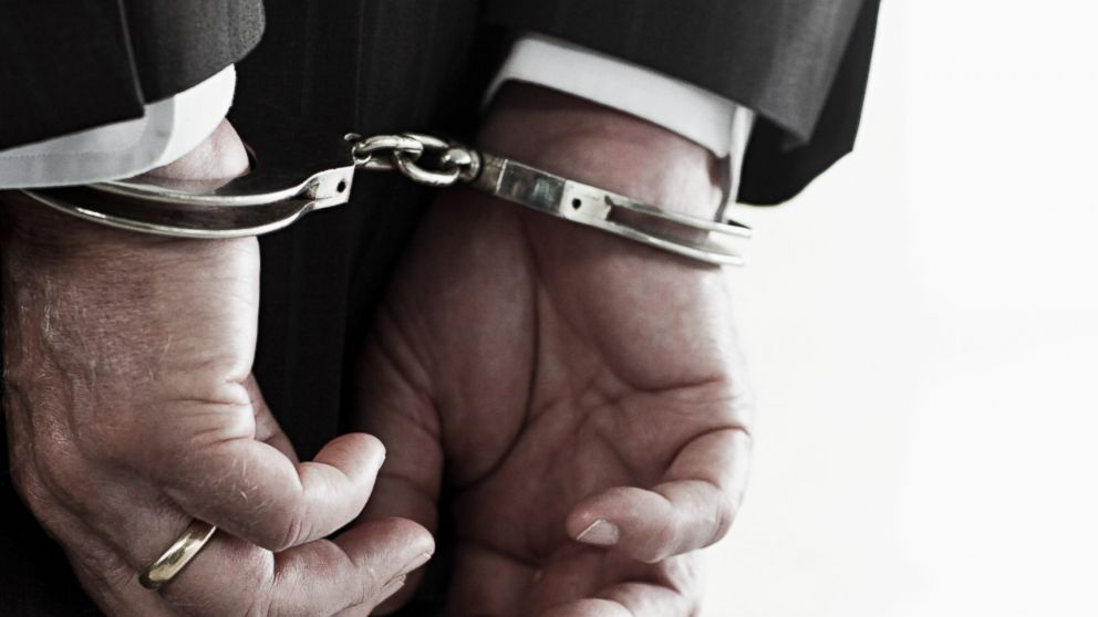 PHOTO: In this stock image, a businessman in handcuffs is pictured. 