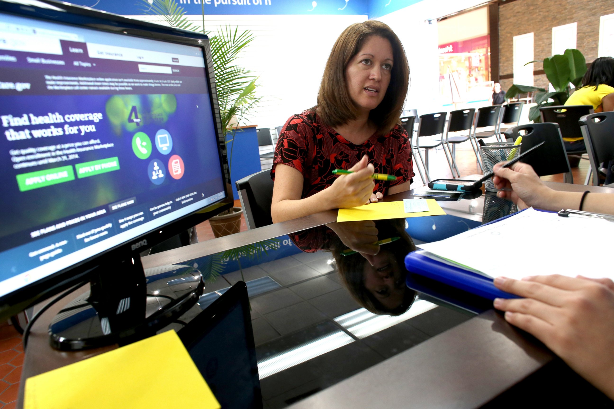 PHOTO: A Florida woman looks to purchase an insurance policy under the Affordable Care Act at the store setup in the Westland Mall in Hialeah, Fla., Nov. 14, 2013.