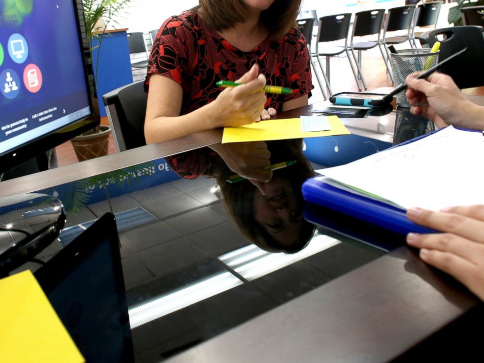 PHOTO: A Florida woman looks to purchase an insurance policy under the Affordable Care Act at the store setup in the Westland Mall in Hialeah, Fla., Nov. 14, 2013.