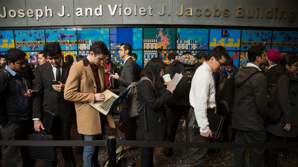 Students wait in line before the start of an engineering and technology career fair at the New York University (NYU) Polytechnic School of Engineering in the Brooklyn borough of New York, Feb. 12, 2015. 