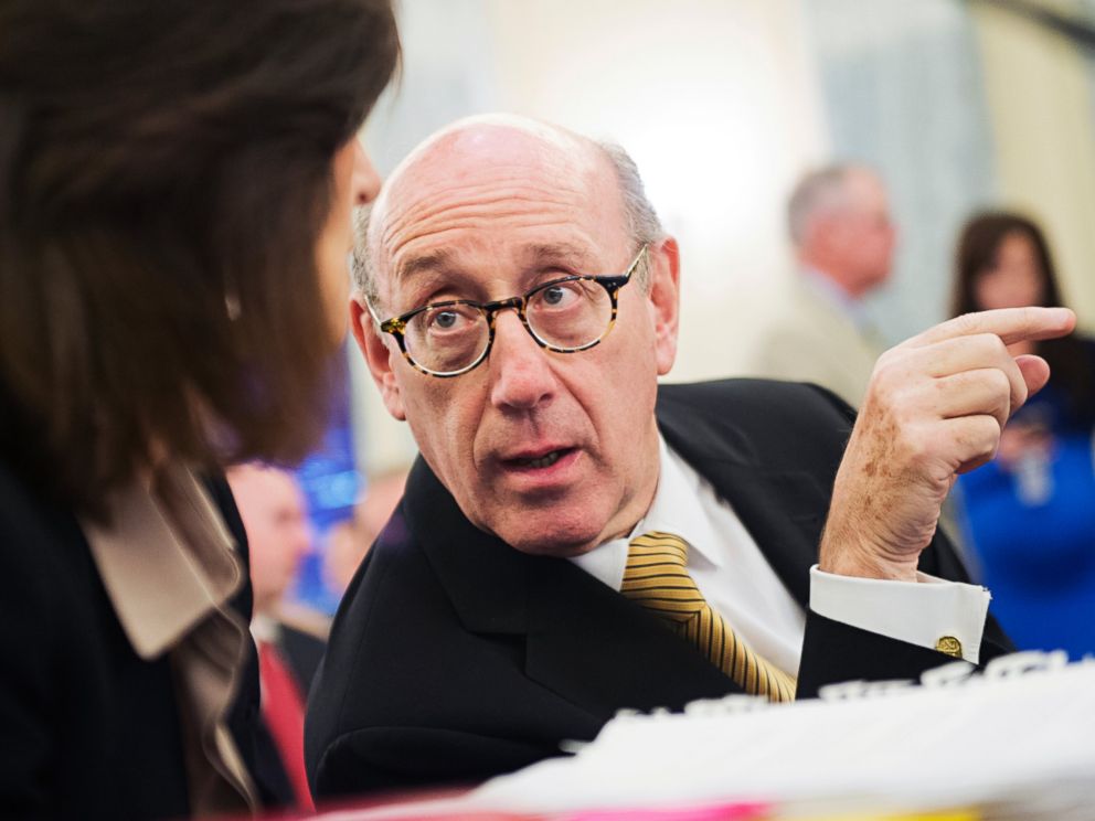 PHOTO: Ken Feinberg talks with colleague Camille Biros in Washington, July 17, 2014.
