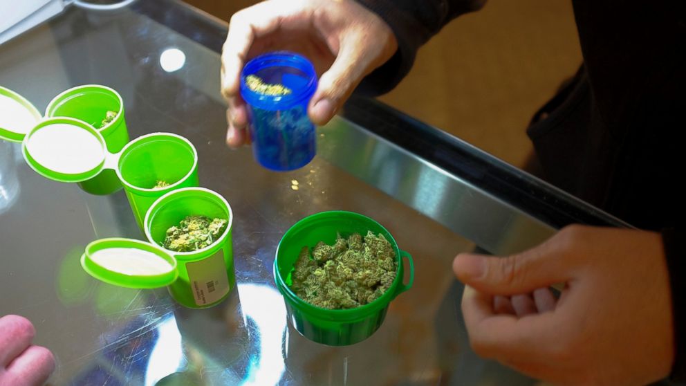 A customer shops for recreational marijuana inside the Evergreen Apothecary in Denver, Colorado in this Jan. 9, 2014, file photo.
