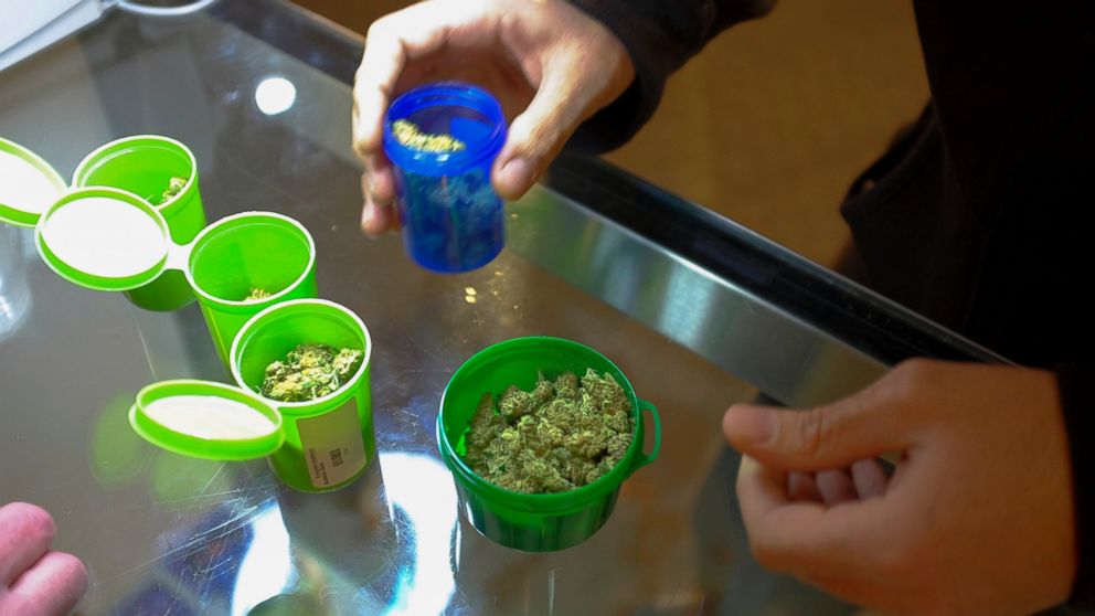A customer shops for recreational marijuana inside the Evergreen Apothecary in Denver, Colorado in this Jan. 9, 2014, file photo.